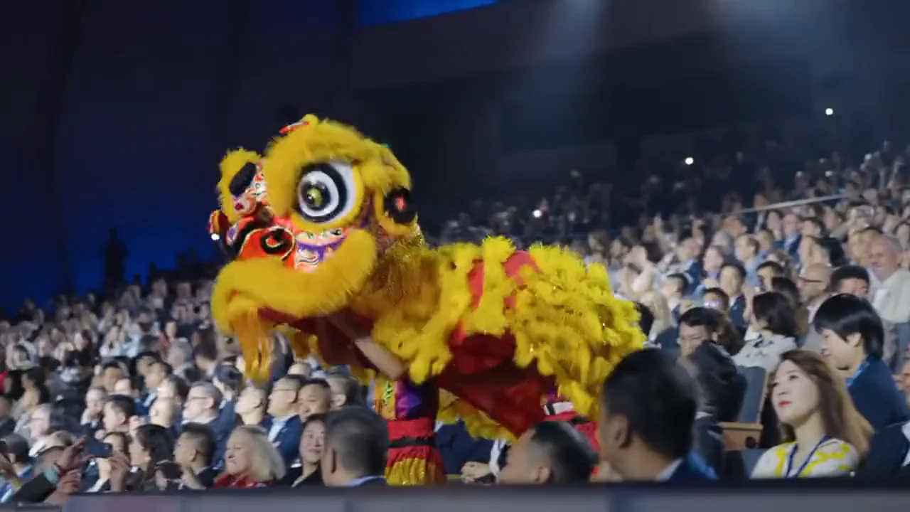 A lion dance on stage in front of the delegates at the Hilton APAC conference